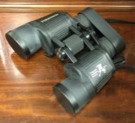 A cased pair of Bushnell binoculars. Est. £30 - £5