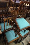 A set of four (plus one) oak dining chairs with sl