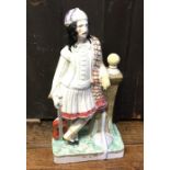 A tall Staffordshire figure of a gentleman. Approx