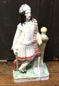 A tall Staffordshire figure of a gentleman. Approx