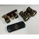 Two pairs of gilt opera glasses. Est. £30 - £50.