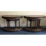 A good pair of 19th Century demi-lune tables of Or