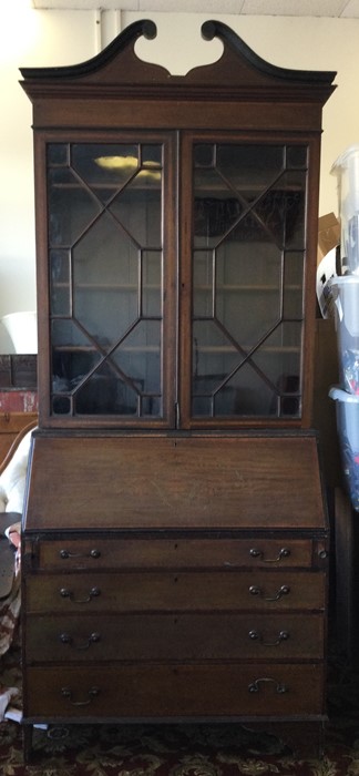 An Edwardian mahogany inlaid bureau bookcase. Est.