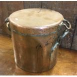 A large copper cooking pot and cover. Est. £30 - £