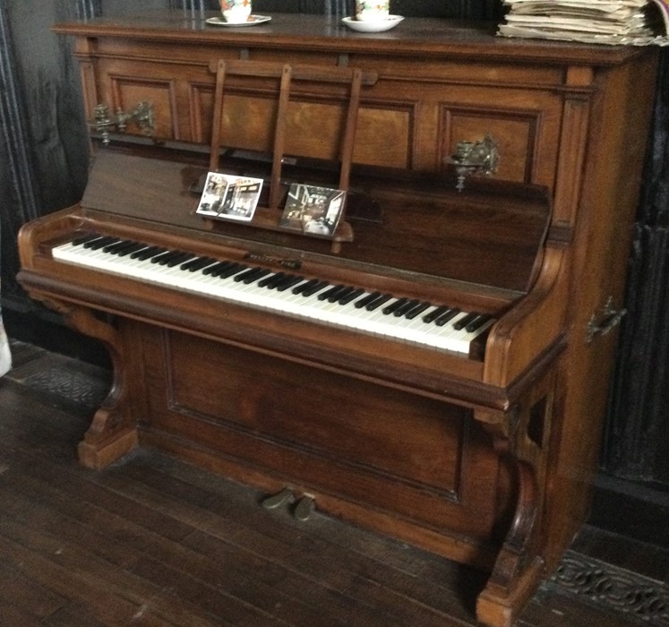 A large mahogany upright piano with brass handles - Image 2 of 2