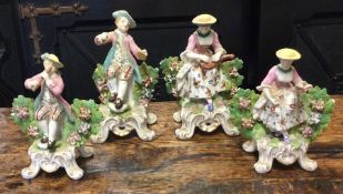 A garniture of four Antique figures on gilt bases.