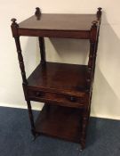 A Victorian mahogany whatnot. Est. £50 - £80.