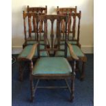 A set of four (plus one) oak dining chairs with sl