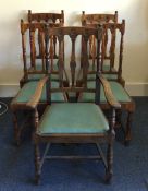 A set of four (plus one) oak dining chairs with sl