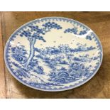 A large blue and white circular Chinese charger de