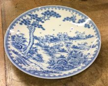 A large blue and white circular Chinese charger de