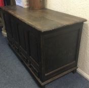 A large heavy oak two drawer mule chest with hinge