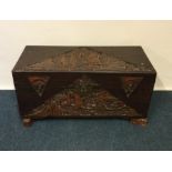 A 20th Century carved camphorwood trunk with hinge