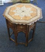 A Moroccan octagonal occasional table. Est. £30 -