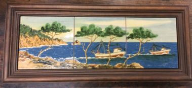 A Spanish framed trio of tiles depicting fishing t