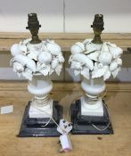 A pair of tall decorative urn shaped lamps decorat
