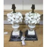 A pair of tall decorative urn shaped lamps decorat