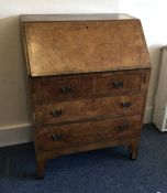 A burr walnut four drawer fall front bureau. Est.