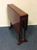 A Victorian mahogany two flap dining table. Est. £