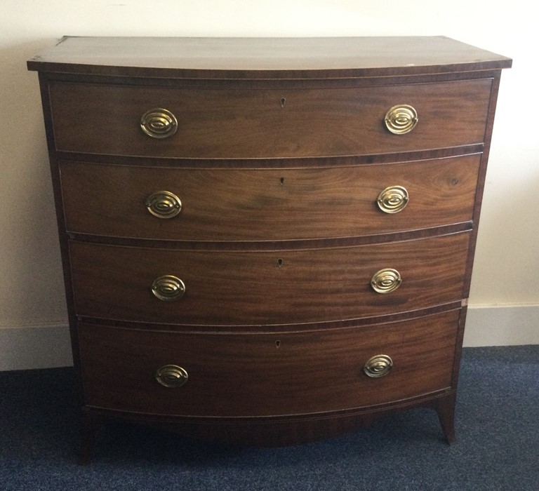 A Georgian mahogany bow front chest of four drawer