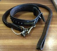 An old leather dog lead and collar together with t