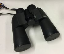 A cased pair of Pentax binoculars. Est. £30 - £50.