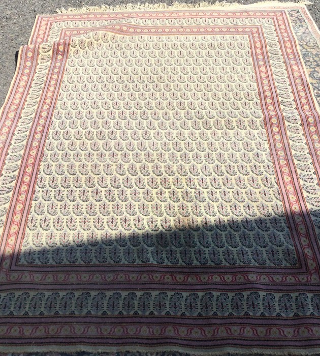 A large cotton rug with pink border. Est. £50 - £8