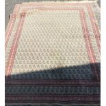 A large cotton rug with pink border. Est. £50 - £8