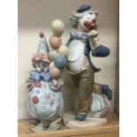 A novelty Lladro figure in the form of a clown tog