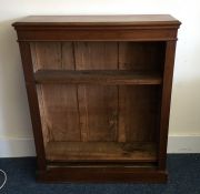 An Edwardian mahogany bookcase on pedestal foot to