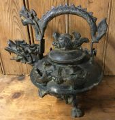 A large Chinese bronze kettle with lift-off cover