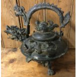 A large Chinese bronze kettle with lift-off cover