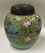 A large decorative Chinese ginger jar and cover wi
