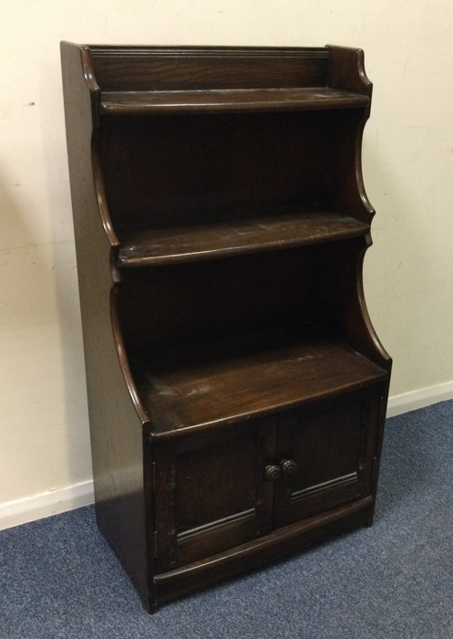 An Edwardian oak two door side cabinet. Est. £30 -