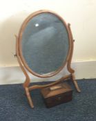 An Edwardian mahogany mirror together with a tea c