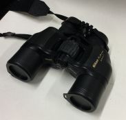 A cased pair of Nikon binoculars. Est. £30 - £50.