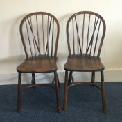 A pair of Antique oak stick back chairs. Est. £20