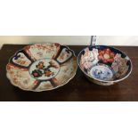 A decorative Imari bowl in bright colours together