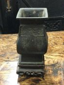 A Chinese bronze vase on wooden base. Approx. 13 c