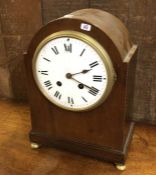 An Edwardian mahogany domed top mantle clock on br