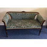 An upholstered chaise longue on tapering feet. Est