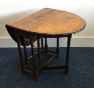 A Victorian mahogany two flap table on bobbin legs
