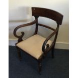 A Victorian mahogany carver chair with scroll hand