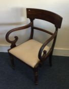 A Victorian mahogany carver chair with scroll hand