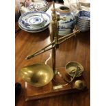 A set of old brass kitchen scales. Est. £25 - £30.