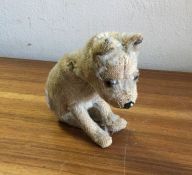 STEIFF: A miniature preloved figure of a dog. Est.
