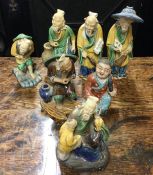 A group of Chinese pottery figures in yellow groun