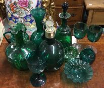 A large collection of green glass. Est. £30 - £50.