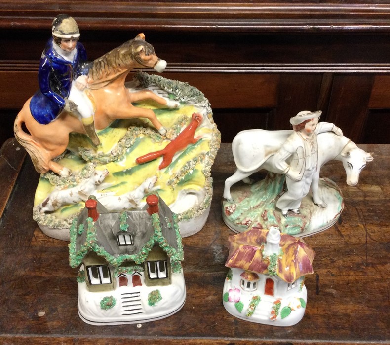 A group of four Staffordshire figures. Est. £20 -