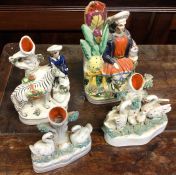 A group of four Staffordshire figures. Est. £20 -